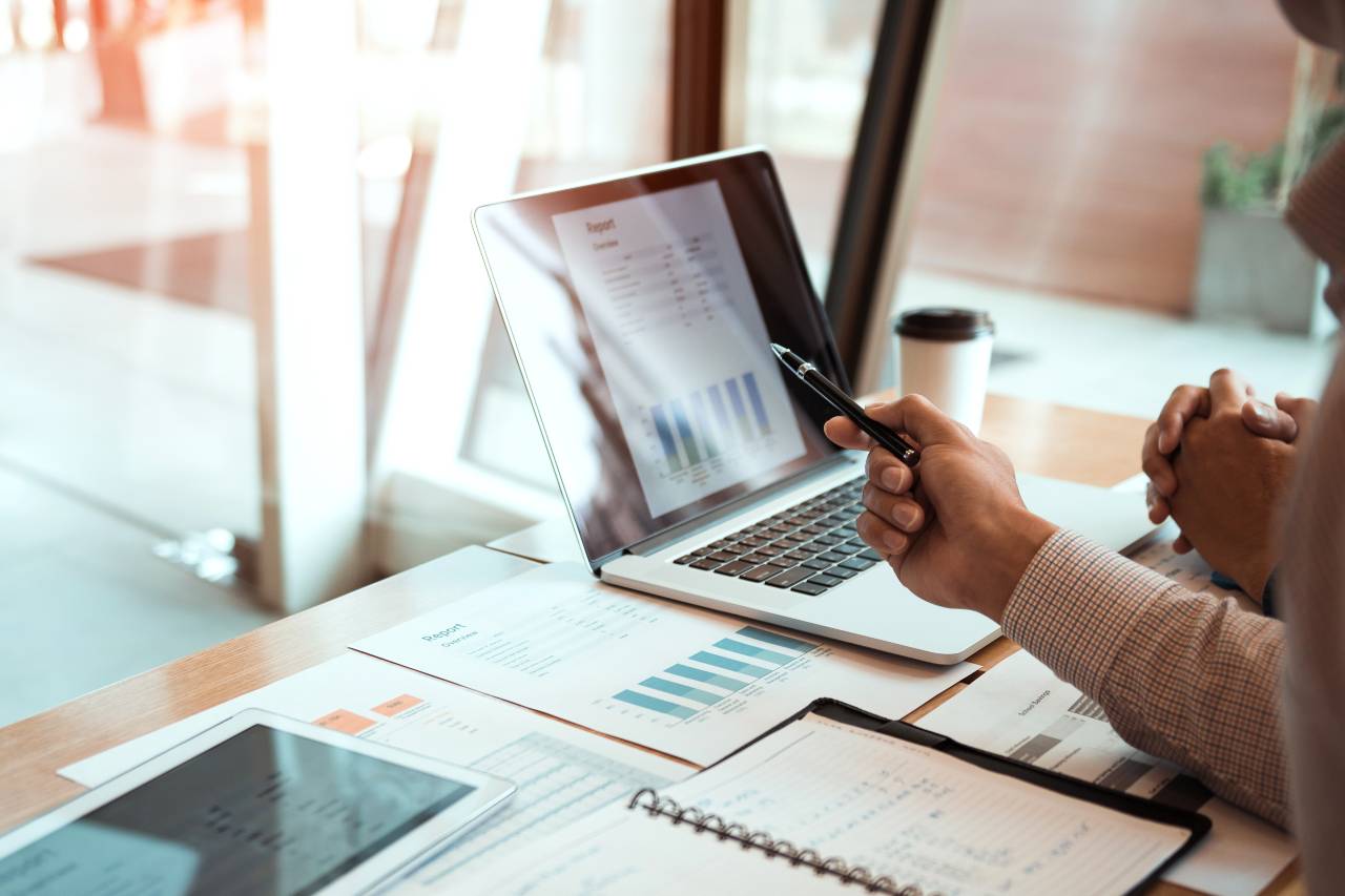 professional_looking_at_document_using_calculator